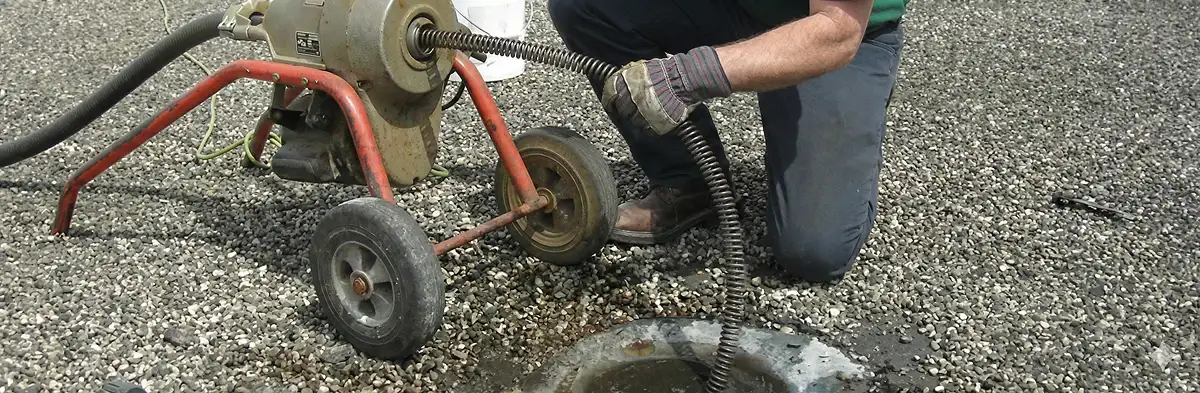 sewer rodding technician actively removing blockages from a sewer line in Milwaukee, WI