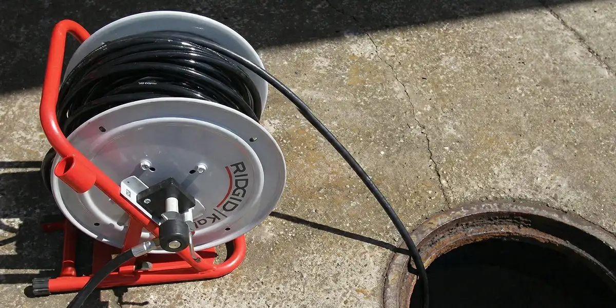 sewer rodding equipment prepared to clear clogged sewer lines in Milwaukee, WI