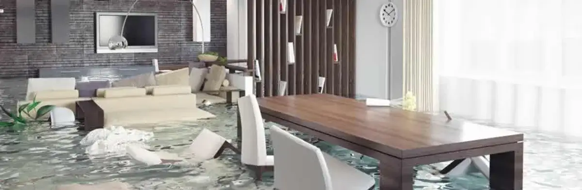 home interior affected by water damage with flooded floors and displaced furniture in Milwaukee, WI